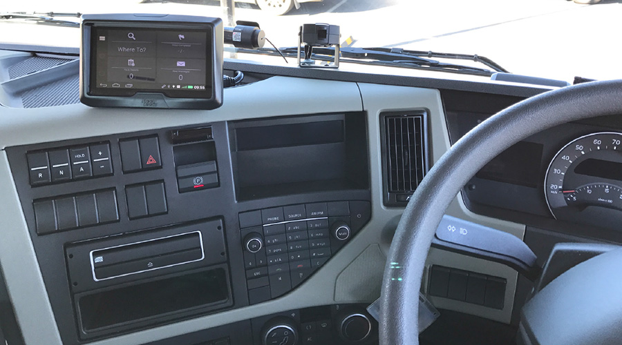 Car dash board with sat-nav and a small camera pointing to where the driver would sit Car dash board with sat-nav and a small camera pointing to where the driver would sit