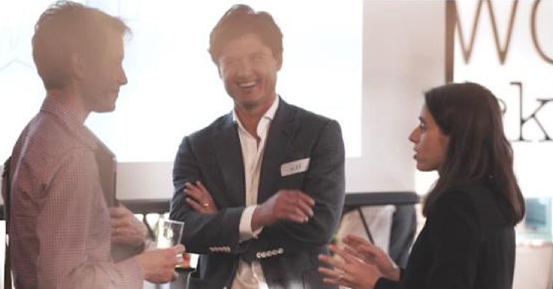 Three people standing and talking Three people standing and talking