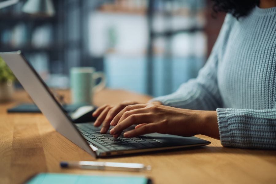 A person typing on a computer