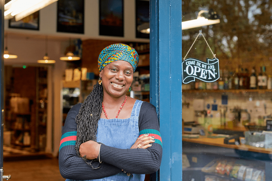 A cafe owner hanging up a closed sign