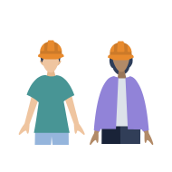 Two people wearing hard hats standing together